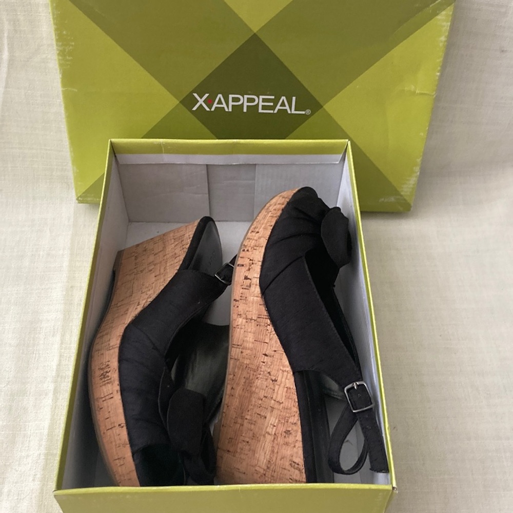 Women’s black and cork wedge heels. Size 9